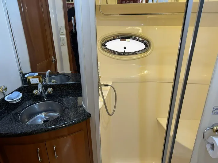 River Dancer Yacht Photos Pics Bathroom interior of 2004 Carver 466 Motor Yacht with sink and shower.