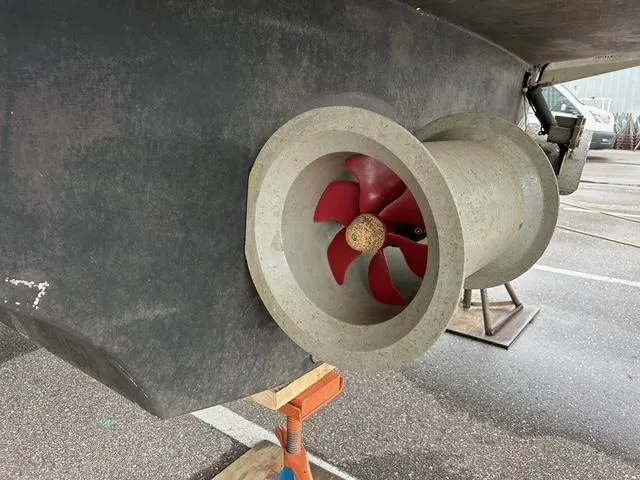 River Dancer Yacht Photos Pics Close-up of a 2004 Carver 466 Motor Yacht's red propeller in dry dock.