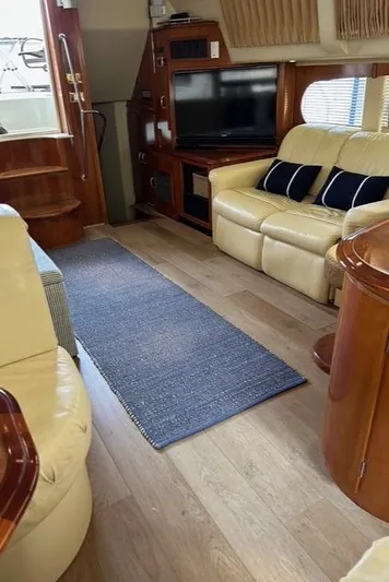 River Dancer Yacht Photos Pics Interior of 2004 Carver 466 Motor Yacht with leather seating and entertainment area.