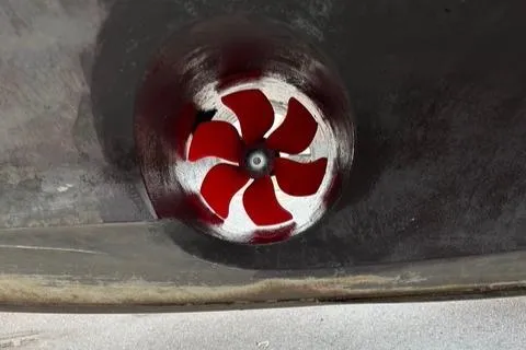 River Dancer Yacht Photos Pics Red propeller of a 2004 Carver 466 Motor Yacht, close-up view.