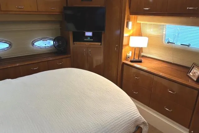 River Dancer Yacht Photos Pics Luxurious interior of 2004 Carver 466 Motor Yacht with cozy bedroom and modern amenities.