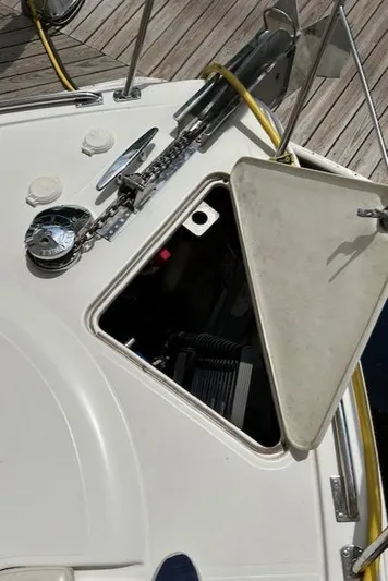 River Dancer Yacht Photos Pics Open hatch on 2004 Carver 466 Motor Yacht deck, revealing interior components.