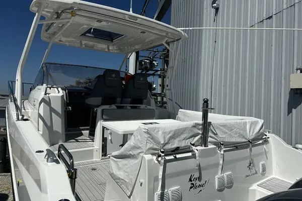 Keys Please! Yacht Photos Pics 2024 Jeanneau Leader 9.0 WA boat docked, featuring spacious deck and modern design.