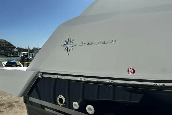 Keys Please! Yacht Photos Pics 2024 Jeanneau Leader 9.0 WA boat, rear view with logo and star emblem.