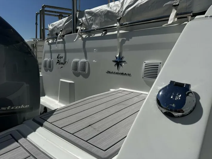 Keys Please! Yacht Photos Pics 2024 Jeanneau Leader 9.0 WA boat stern with logo and deck details.