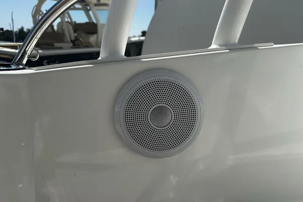 Keys Please! Yacht Photos Pics 2024 Jeanneau Leader 9.0 WA boat speaker detail, white exterior, close-up view.