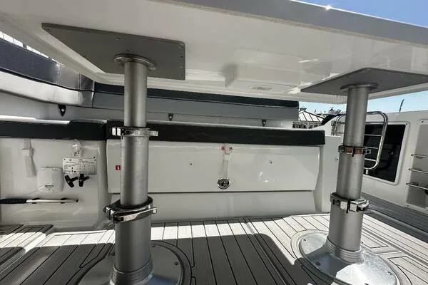 Keys Please! Yacht Photos Pics 2024 Jeanneau Leader 9.0 WA boat interior with adjustable table and sleek design.
