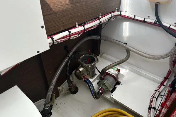 Keys Please! Yacht Photos Pics 2024 Jeanneau Leader 9.0 WA engine compartment with hoses and wiring.