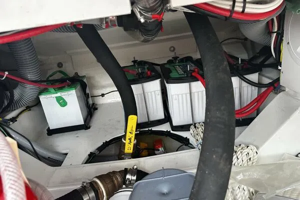 Keys Please! Yacht Photos Pics Battery compartment of 2024 Jeanneau Leader 9.0 WA boat, showing wiring and connections.