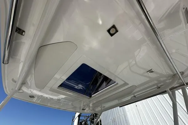 Keys Please! Yacht Photos Pics 2024 Jeanneau Leader 9.0 WA boat roof with hatch and stainless steel fittings.