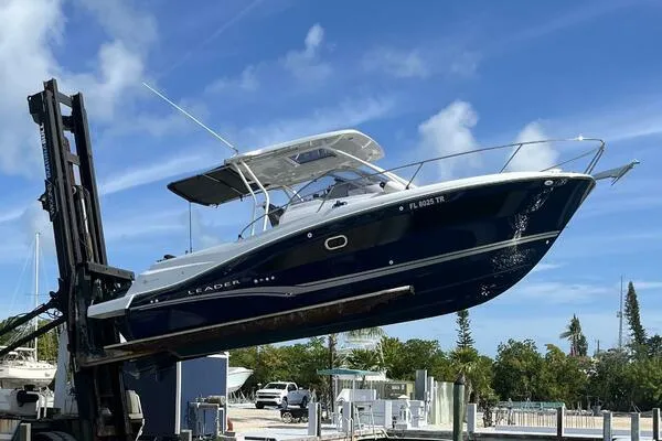 Keys Please! Yacht Photos Pics 2024 Jeanneau Leader 9.0 WA boat lifted by forklift at marina.