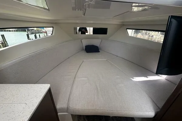 Keys Please! Yacht Photos Pics 2024 Jeanneau Leader 9.0 WA cabin interior with spacious seating and modern design.