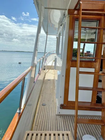  Yacht Photos Pics 1981 Grand Banks 42 Europa yacht deck with wooden railings and ocean view.