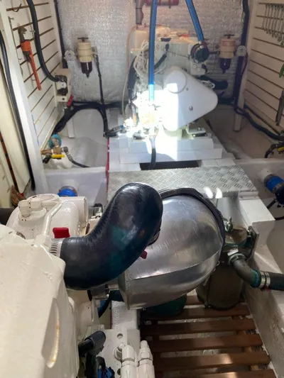  Yacht Photos Pics Engine room of 1981 Grand Banks 42 Europa, showcasing mechanical components and piping.