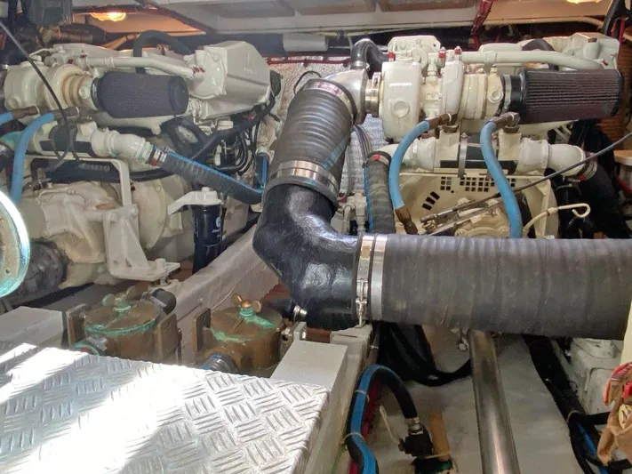  Yacht Photos Pics Engine room of 1981 Grand Banks 42 Europa yacht, featuring dual engines and piping.