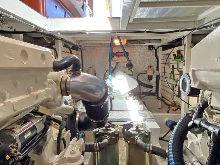  Yacht Photos Pics Engine room of 1981 Grand Banks 42 Europa, showcasing mechanical components and piping.