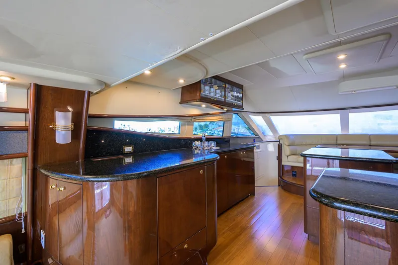 Aye Roller Yacht Photos Pics Luxurious interior of 2008 Neptunus 62 Flybridge yacht with elegant wood finishes.