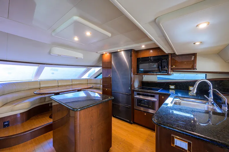 Aye Roller Yacht Photos Pics Luxurious kitchen interior of 2008 Neptunus 62 Flybridge yacht with modern appliances.