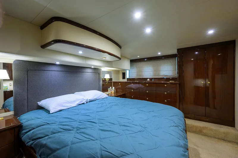Aye Roller Yacht Photos Pics Luxurious bedroom in 2008 Neptunus 62 Flybridge yacht with elegant wood finishes.