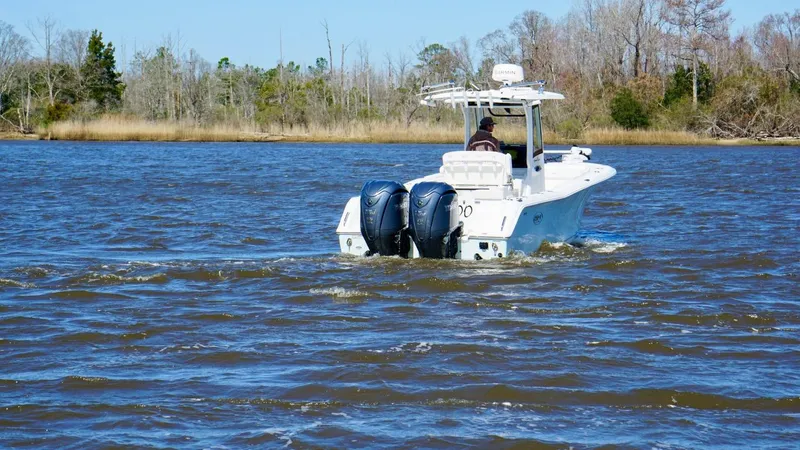  Yacht Photos Pics 2023 Sea Hunt Gamefish 27 boat cruising on a lake with dual engines.
