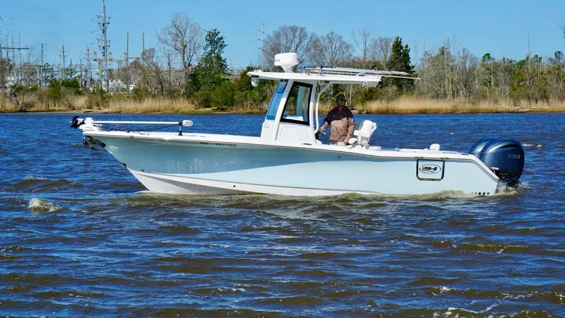 Yacht Photos Pics 2023 Sea Hunt Gamefish 27 boat cruising on a river with forward seating.