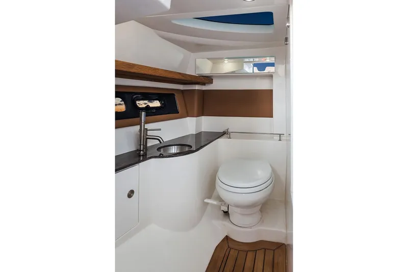  Yacht Photos Pics Manufacturer Provided Image: 2019 Sea Ray SLX 350 boat bathroom with modern fixtures and wooden accents.