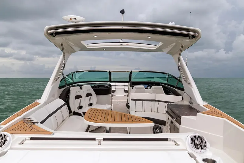  Yacht Photos Pics Manufacturer Provided Image: 2019 Sea Ray SLX 350 luxury boat interior with teak accents on open water.