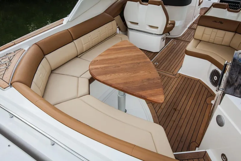  Yacht Photos Pics Manufacturer Provided Image: 2019 Sea Ray SLX 350 boat interior with tan leather seating and wooden table.