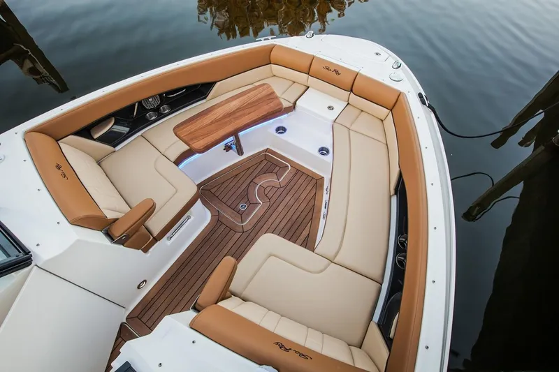  Yacht Photos Pics Manufacturer Provided Image: 2019 Sea Ray SLX 350 boat with luxurious tan seating and wooden deck.