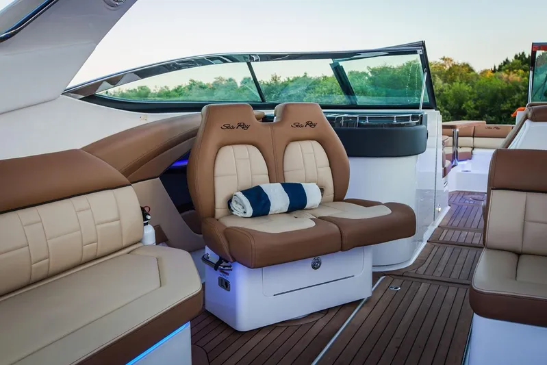  Yacht Photos Pics Manufacturer Provided Image: 2019 Sea Ray SLX 350 boat interior with tan leather seats and wooden deck.