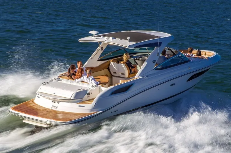  Yacht Photos Pics Manufacturer Provided Image: 2019 Sea Ray SLX 350 cruising on water with passengers enjoying the ride.