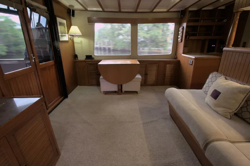 Ursa Minor Yacht Photos Pics Interior of 1988 Kadey-Krogen Krogen 54 yacht, featuring cozy seating and wooden accents.