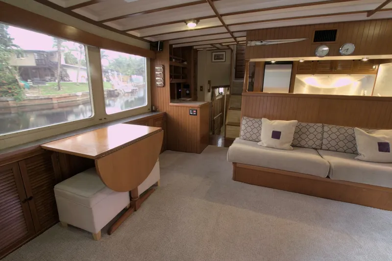 Ursa Minor Yacht Photos Pics Interior of 1988 Kadey-Krogen Krogen 54 yacht with cozy seating and dining area.