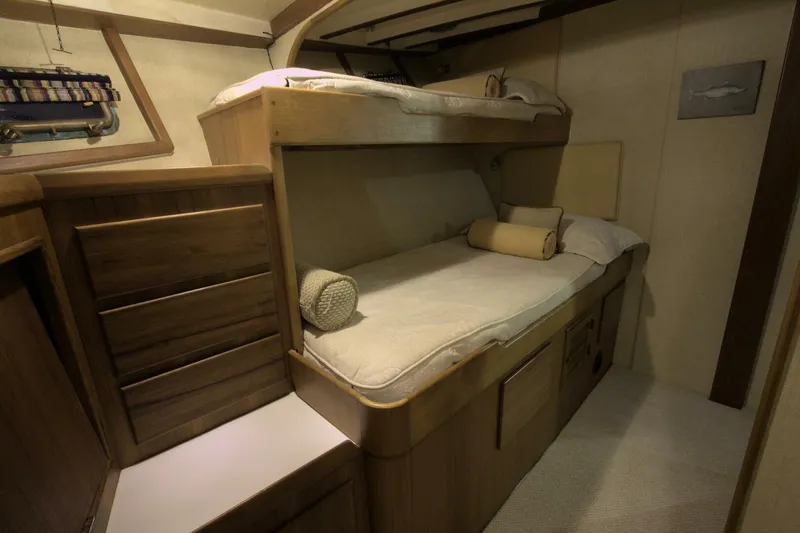Ursa Minor Yacht Photos Pics 1988 Kadey-Krogen Krogen 54 cabin with wooden bunk beds and storage.