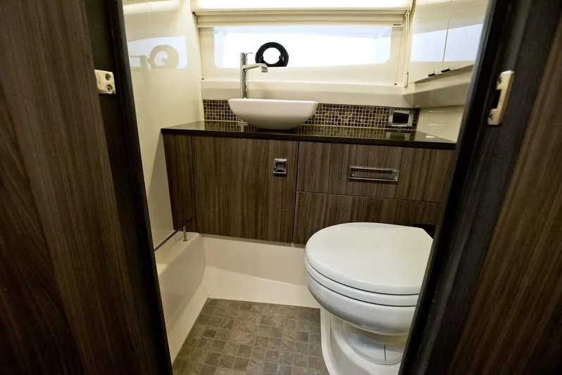 Sensei I Yacht Photos Pics Manufacturer Provided Image: Modern bathroom in 2021 Sea Ray SLX 400 boat with sink and toilet.