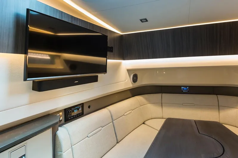 Sensei I Yacht Photos Pics Manufacturer Provided Image: Interior of 2021 Sea Ray SLX 400 with TV, modern seating, and ambient lighting.