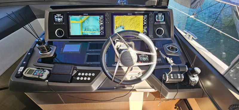  Yacht Photos Pics Cockpit of 2019 Sunseeker Manhattan 66 yacht with advanced navigation systems.