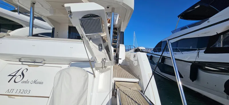  Yacht Photos Pics 2019 Sunseeker Manhattan 66 yacht docked, featuring sleek design and luxurious amenities.