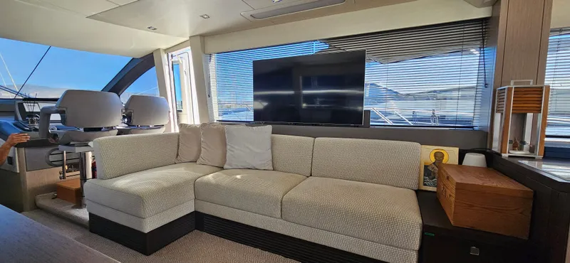  Yacht Photos Pics Luxurious interior of 2019 Sunseeker Manhattan 66 yacht with plush seating and large TV.