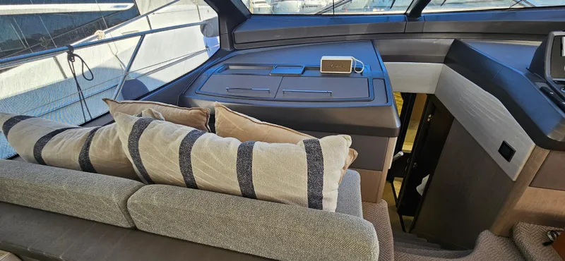  Yacht Photos Pics Interior of 2019 Sunseeker Manhattan 66 yacht with modern seating and navigation area.