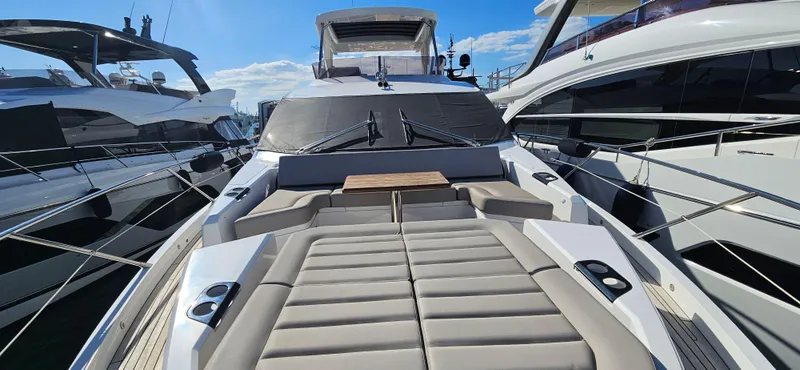  Yacht Photos Pics 2019 Sunseeker Manhattan 66 yacht with spacious deck and luxurious seating.