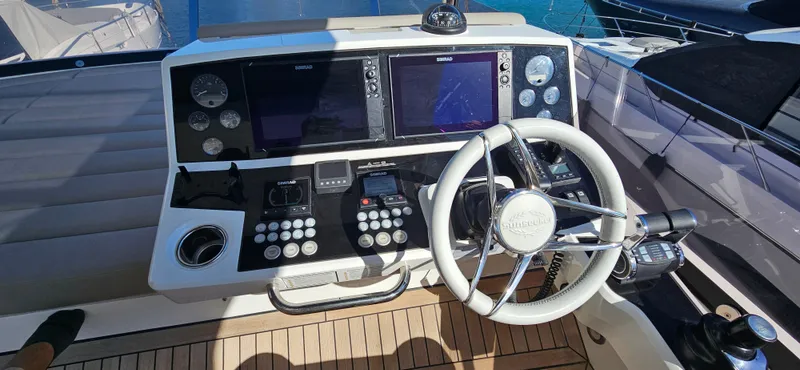  Yacht Photos Pics 2019 Sunseeker Manhattan 66 yacht helm with advanced navigation controls and steering wheel.