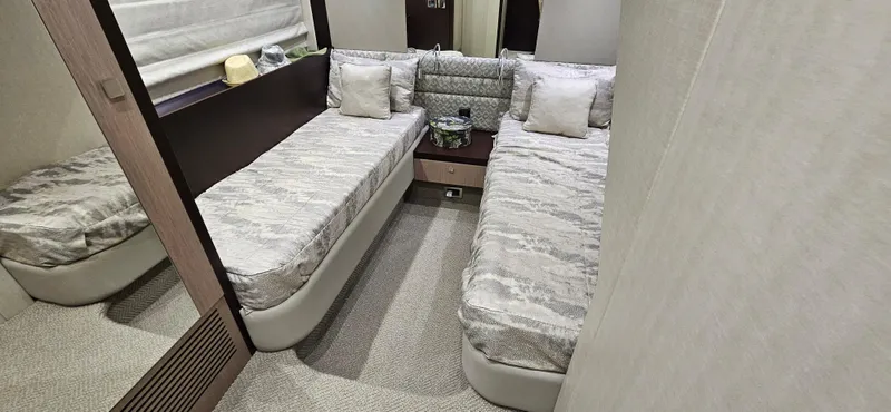 Yacht Photos Pics Luxurious twin bedroom in 2019 Sunseeker Manhattan 66 yacht, featuring modern decor and comfortable bedding.
