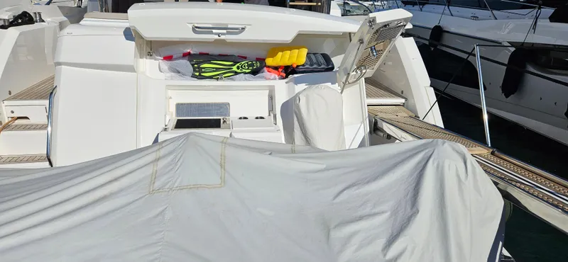  Yacht Photos Pics 2019 Sunseeker Manhattan 66 yacht with open storage, docked at marina.