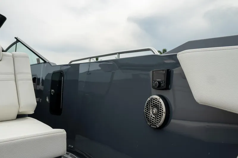 Di Blue Yacht Photos Pics 2022 Cruisers Yachts 38 GLS interior with white seating and audio system, showcasing luxury design.