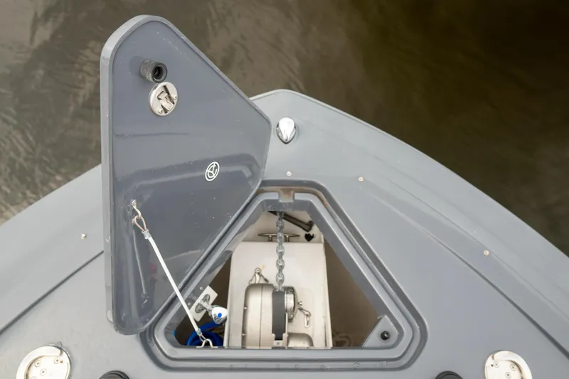 Di Blue Yacht Photos Pics Anchor compartment of 2022 Cruisers Yachts 38 GLS, featuring open hatch and chain mechanism.