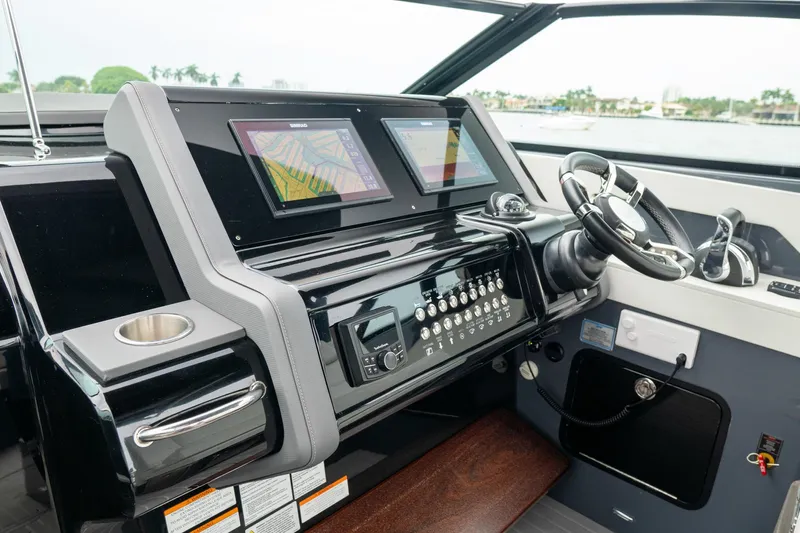 Di Blue Yacht Photos Pics 2022 Cruisers Yachts 38 GLS helm with dual displays and modern controls.