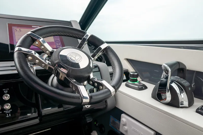 Di Blue Yacht Photos Pics 2022 Cruisers Yachts 38 GLS helm with steering wheel and controls.