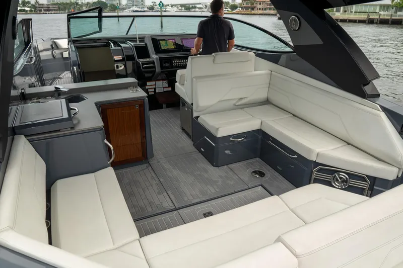 Di Blue Yacht Photos Pics 2022 Cruisers Yachts 38 GLS interior with spacious seating and modern helm.