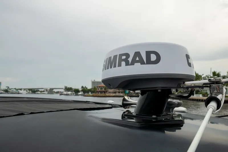 Di Blue Yacht Photos Pics 2022 Cruisers Yachts 38 GLS with Simrad radar on deck, cruising on a calm waterway.